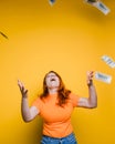 Portrait of a happy young woman, throwing banknotes Royalty Free Stock Photo