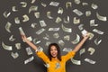 Portrait of a happy young woman throwing out money banknotes isolated over white background Royalty Free Stock Photo