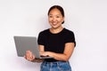 Portrait of happy young woman using laptop Royalty Free Stock Photo