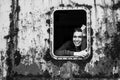 Portrait of happy young woman in the window vintage train.