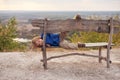 Portrait of happy young boy sitting on a wooden bench outdoors Royalty Free Stock Photo