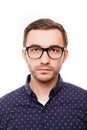 Portrait of hapy young smart man in glasses on white background