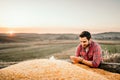 harvester at sunset enjoying his harvest in tractor trailer Royalty Free Stock Photo