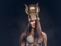 Portrait of haughty Egyptian queen in an ancient pharaoh costume. Royalty Free Stock Photo