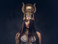 Portrait of haughty Egyptian queen in an ancient pharaoh costume. Royalty Free Stock Photo