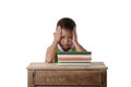 Portrait of headache little student asian boy with many books education and school concept isolated on white background Royalty Free Stock Photo