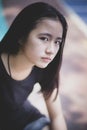 Portrait headshot of beautiful asian teenager looking with eyes contact outdoor Royalty Free Stock Photo