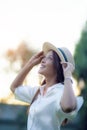 Portrait headshot of beautiful asian woman toothy smiling face with happiness emotion standing outdoor