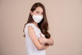 Portrait of health care asian young woman wearing face mask protect, getting vaccine of covid-19, influenza in white t-shirt, Royalty Free Stock Photo