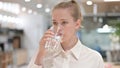 Portrait of Healthy Businessman Drinking Water