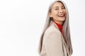 Portrait of healthy and happy asian senior woman, middle aged korean lady with long grey hair, laughing and smiling Royalty Free Stock Photo
