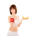 Portrait of healthy woman with apple and banana