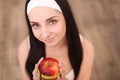 Portrait of a healthy woman with apple and measuring tape. Healthy fitness and eating lifestyle concept. Royalty Free Stock Photo