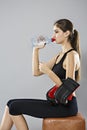 Portrait of a healthy woman with bottle of water. Healthy lifestyle concept. Sporty girl with beautiful body Royalty Free Stock Photo