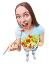 Portrait of a healthy woman eating a fresh salad. Royalty Free Stock Photo