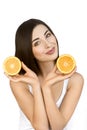 Portrait of Healthy Woman with Two Halves of Orange in Hands on White Background. Royalty Free Stock Photo