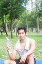 Portrait of healthy young man holding bottle of water Royalty Free Stock Photo