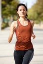 Healthy young woman jogging outdoors Royalty Free Stock Photo