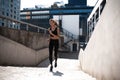 Portrait of a healthy young woman running outdoors. Royalty Free Stock Photo