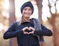 Portrait, heart hands and smile of woman hiking outdoors for wellness and fitness. Valentines day, love emoji and happy