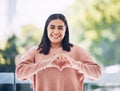 Portrait, heart hands and young woman for self care, cardiology wellness and gen z support for women health. Face of a