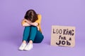 Portrait of her she fired miserable skilled experienced girl sitting on floor with poster looking for a job staff