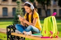 Portrait of her she nice attractive charming cute lovely cheerful cheery wavy-haired girl sitting on bench rest relax