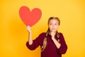 Portrait of her she nice attractive charming lovely curious confused pre-teen girl thinking holding in hand big heart Royalty Free Stock Photo