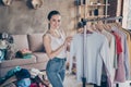 Portrait of her she nice attractive cheerful cheery girl choosing daily wear shirt pullover organizing space casual Royalty Free Stock Photo
