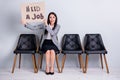 Portrait of her she nice attractive desperate fired lady executive manager sitting in chair holding poster seeking job Royalty Free Stock Photo