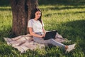 Portrait of her she nice attractive focused smart clever skilled girl it expert specialist programmer sitting on lawn