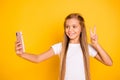 Portrait of her she nice attractive lovely cheerful cheery funny positive girlish pre-teen girl holding cell in hands Royalty Free Stock Photo