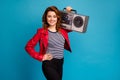 Portrait of her she nice attractive lovely cheerful cheery wavy-haired girl carrying vintage boombox stereo Royalty Free Stock Photo
