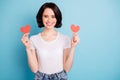 Portrait of her she nice attractive lovely sweet winsome cheerful cheery girl holding in hands two heart symbol cards Royalty Free Stock Photo