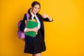 Portrait of her she nice attractive pretty cheerful cheery glad schoolgirl holding in hand learning materials showing