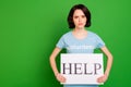 Portrait of her she nice attractive sullen gloomy grumpy depressed girl wearing blue t-shirt holding in hands help sign