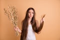 Portrait of her she nice-looking attractive gloomy moody grumpy lady holding in hand dried flower messy thin weak ends