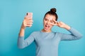 Portrait of her she nice-looking attractive lovely crazy cheerful girl holding in hand cell taking selfie showing v-sign Royalty Free Stock Photo