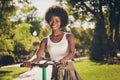 Portrait of her she nice-looking attractive pretty lovely cheerful cheery girl riding kick scooter bike spending free Royalty Free Stock Photo