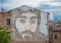 Portrait of the Hero of Ukraine carved on a brick wall