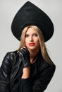 Portrait of High fashion glamour beautiful blonde hair russian style woman in modern hat in black leather gloves Royalty Free Stock Photo