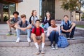 Portrait Of High School Student Group Sitting Outside College Buildings Royalty Free Stock Photo