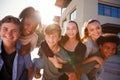 Portrait Of High School Students Giving Each Other Piggybacks College Buildings