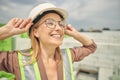 Attractive young blonde construction worker looking up Royalty Free Stock Photo