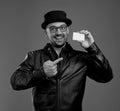 Portrait of hilarious stylish man with a credit card