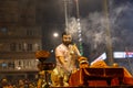 Portrait of hindu male priest performing ganga aarti in varanasi