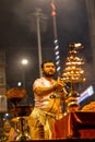 Portrait of hindu male priest performing ganga aarti in varanasi