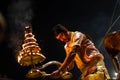 Portrait of hindu male priest performing ganga aarti in varanasi