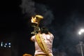 Portrait of hindu male priest performing ganga aarti in varanasi