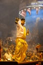 Portrait of hindu male priest performing ganga aarti in varanasi